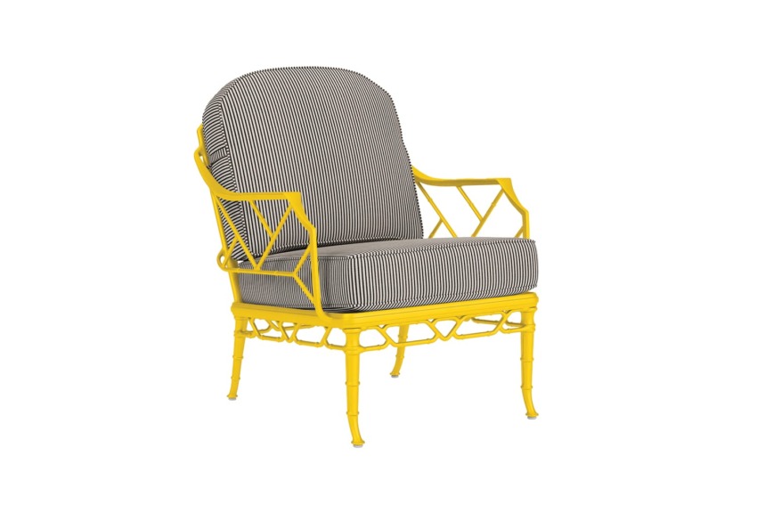 Yellow metal armchair with striped cushions.