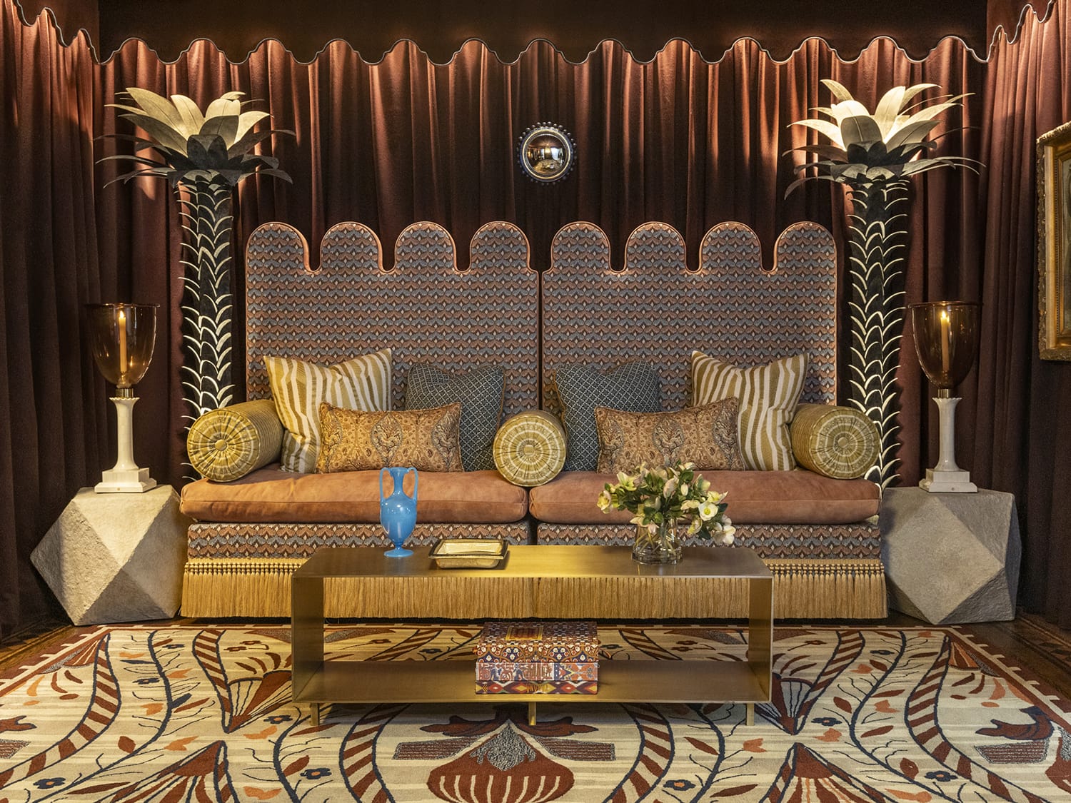 For her “Moroccan Mirage” dining room, designer Julie Rootes covered a custom bench in a Pierre Frey then drew on a range of sumptuous textiles by Sandra Jordan, Sean Leffers, and Robert Kime. A Jiun Ho dining table, Jonathan Browning sconces from De Sousa Hughes, and a Paul Ferrante chandelier add to the magical effect.