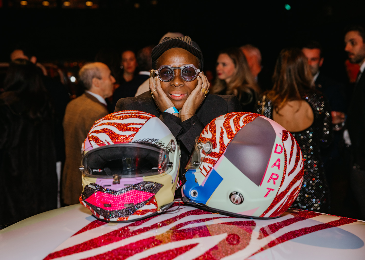 Thomas behind the helmets she created.